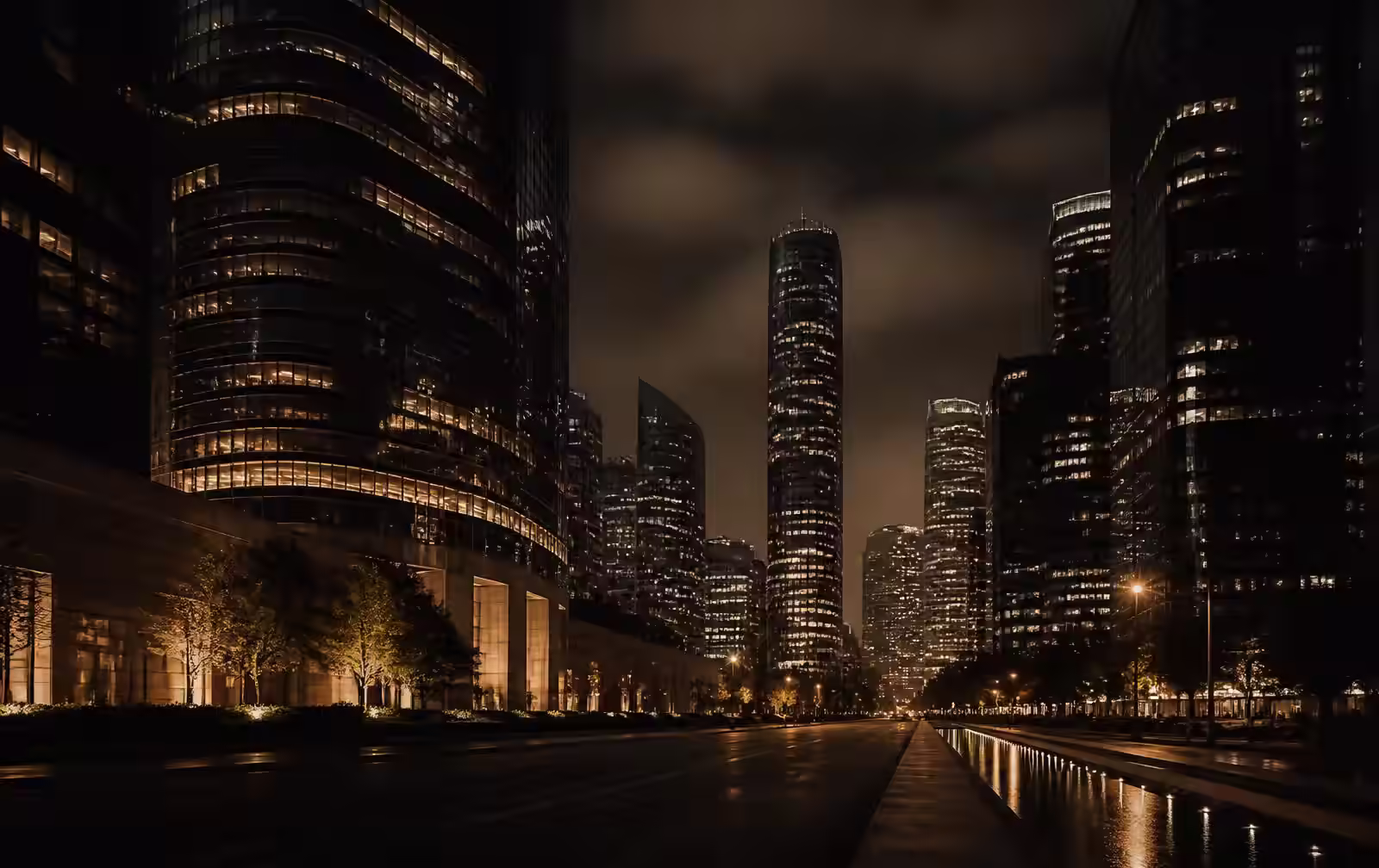 A dim, modern Houston high-rise interior at night overlooking a vast, glittering skyline