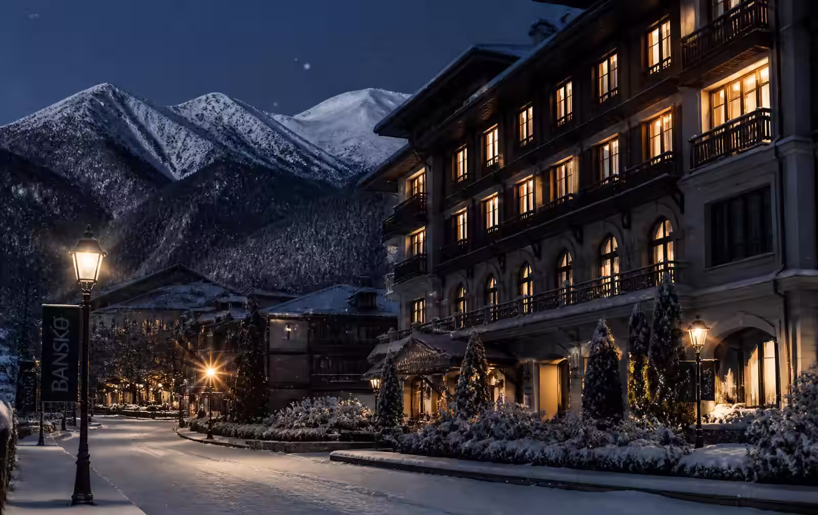 Bansko at night in winter — snow falling past warm-lit hotel windows with dark Pirin mountains behind