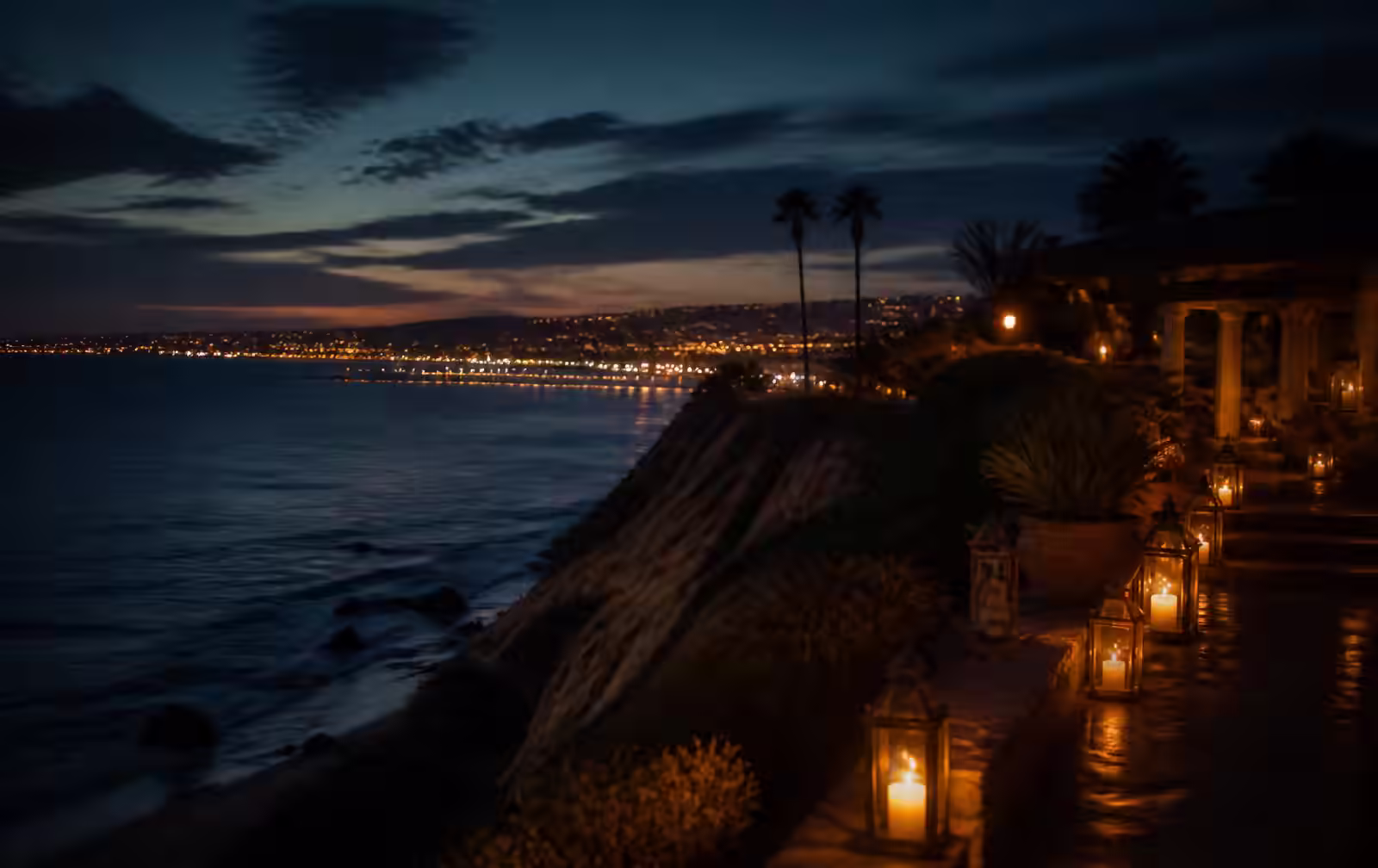 San Diego coastline at evening with warm light from a private terrace overlooking the Pacific