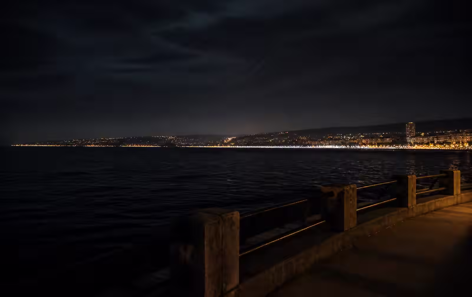 The Varna and Golden Sands coastline at night — resort lights along the dark Black Sea horizon