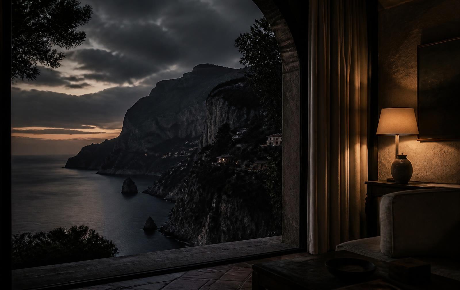 A Mediterranean cliff coastline at deep dusk seen from a warmly lit stone interior