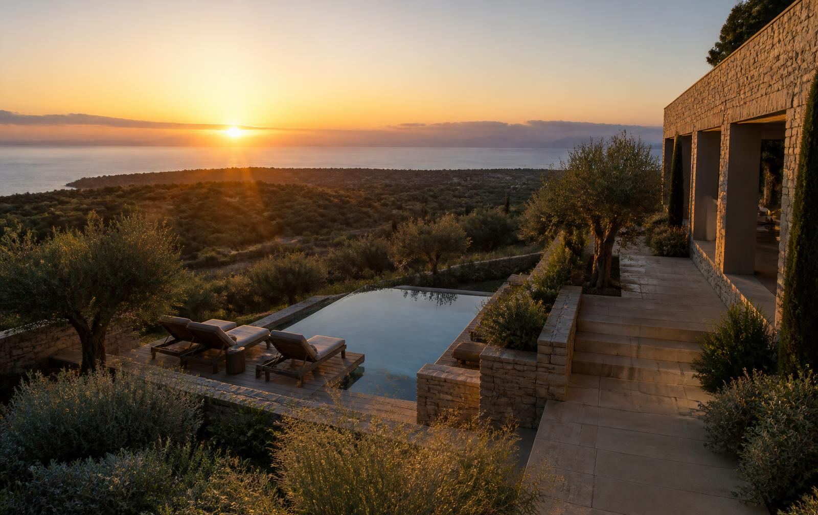 A refined Messinia retreat overlooking olive groves and the Ionian coast at sunset