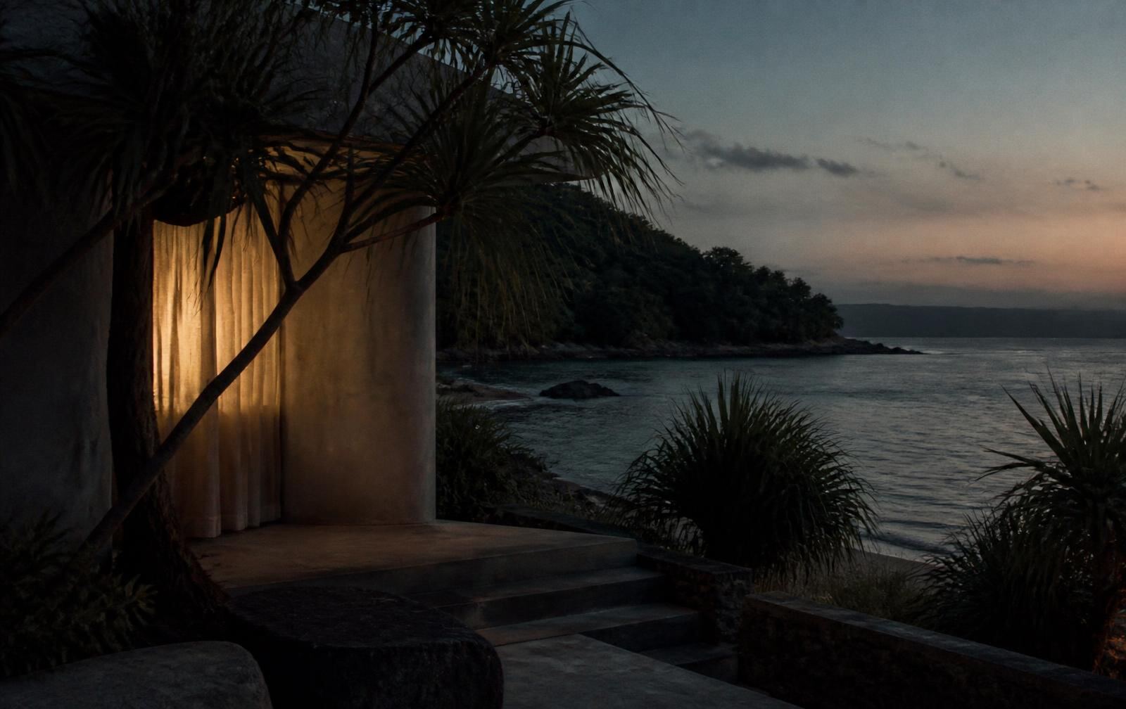 A calm coastal bay at dusk with pandanus, low understated architecture and warm lamp light through a curtain