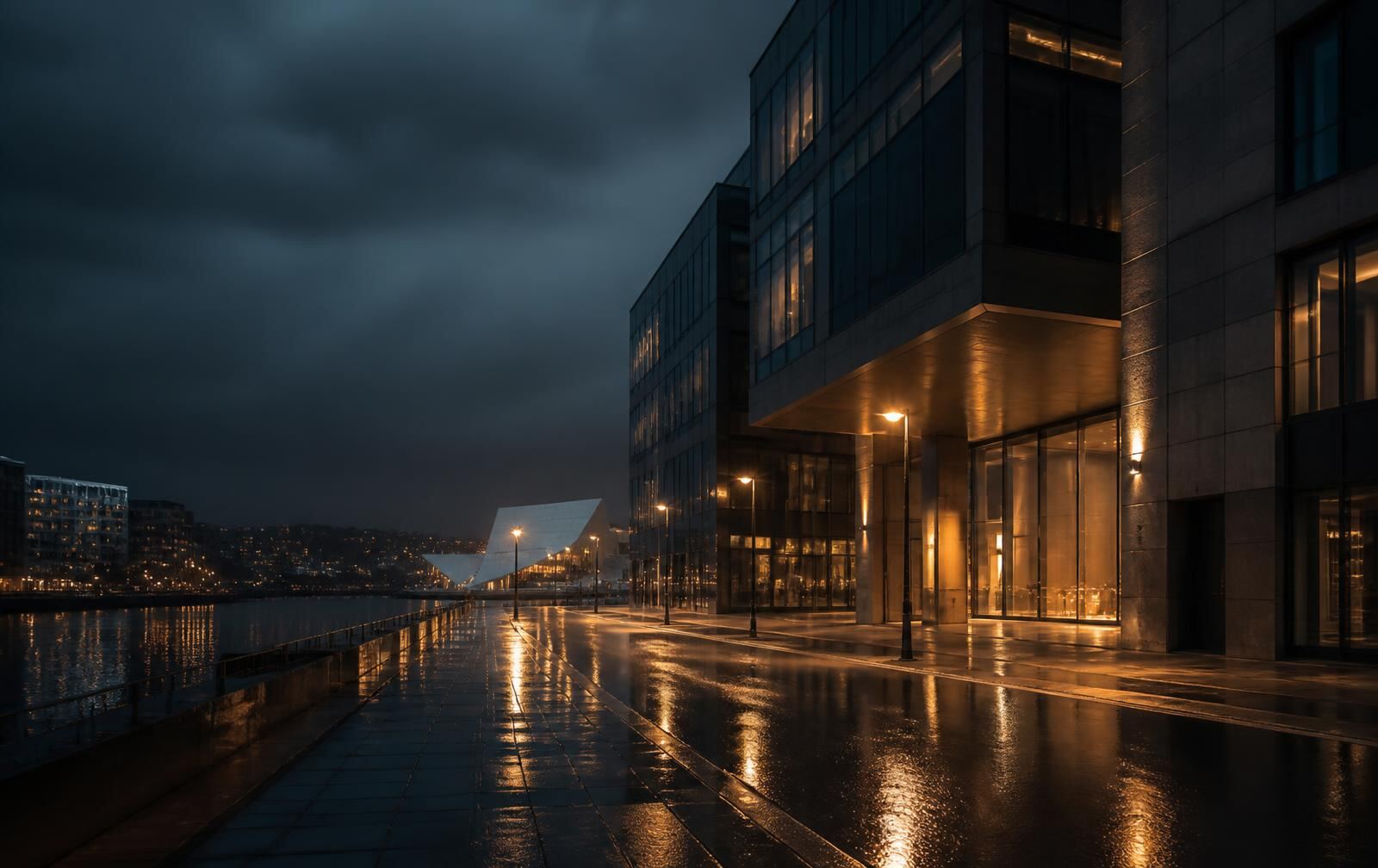 A rain-wet Oslo street at night beside dark modern architecture, warm amber window light reflected in the pavement, harbour water beyond